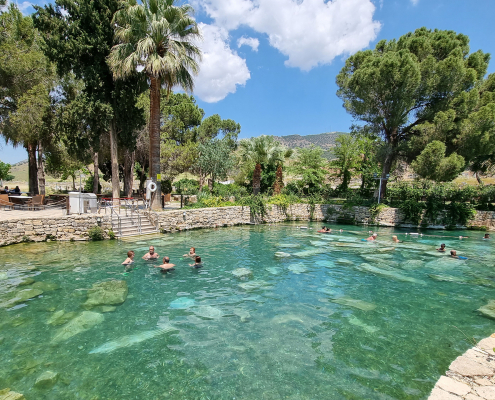 Cleopatra Antique Pool in Hierapolis Pamukkale Visitors swimming in Cleopatra Antique Pool in Hierapolis Pamukkale Turkey